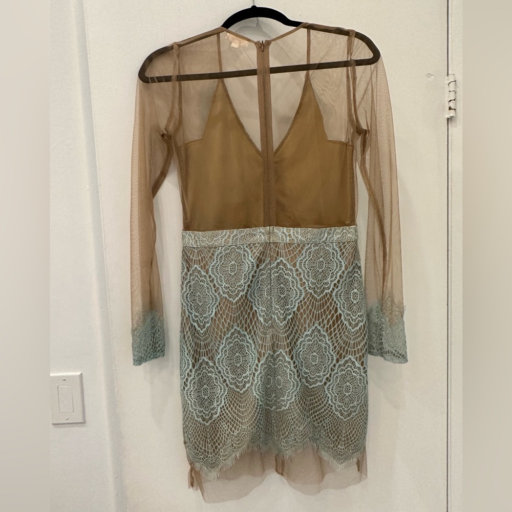 Beautiful cocktail dress with delicates transparency